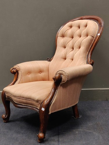 Lot 487 - A Victorian walnut spoonback armchair...