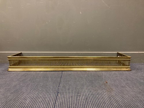 Lot 584 - A brass fender with pierced decoration, 15 x...
