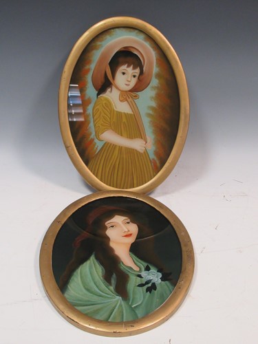 Lot 470 - Two oval reverse glass portraits of a lady and...