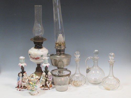 Lot 60 - Three oil lamps, glassware including decanters,...