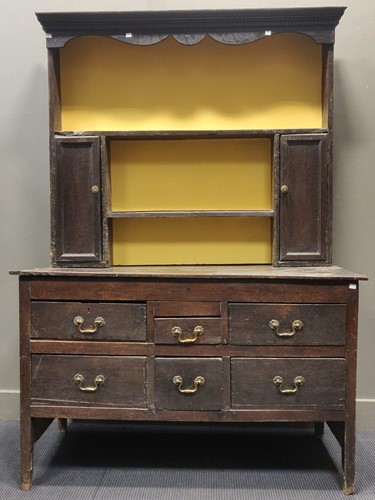 Lot 630 - A 19th century oak dresser, the top section...