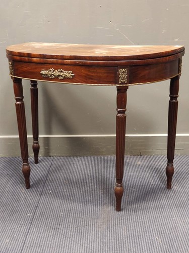 Lot 600 - A Regency style mahogany demi-lune card table...