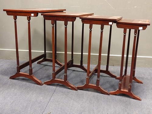 Lot 543 - A Regency style nest of mahogany and satinwood...