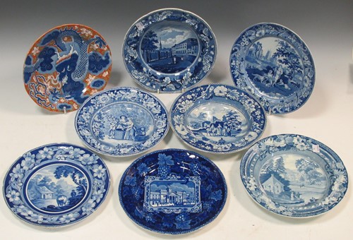 Lot 75 - A collection of twelve pottery blue and white...