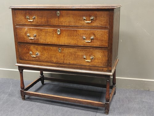 Lot 574 - An oak chest on stand, 108.5 x 110 x 55cm