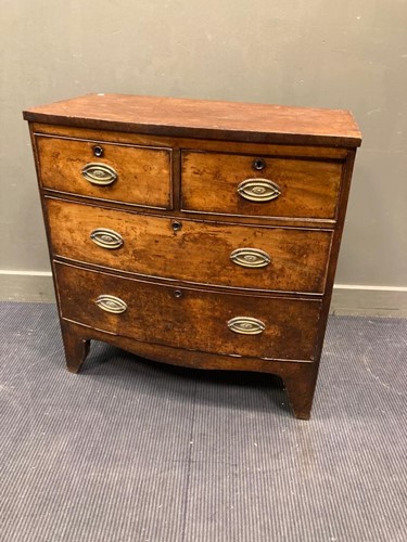 Lot 676 - A Regency mahogany bow front chest of drawers,...