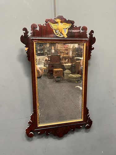 Lot 485 - A fret carved mahogany mirror surmounted by a...