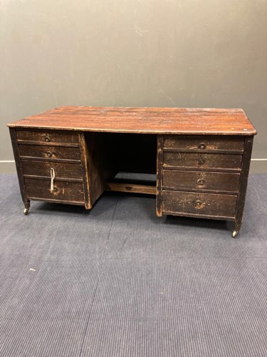Lot 605 - A large stained pine desk comprising of eight...