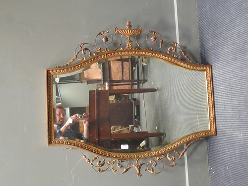 Lot 670 - A Neo-classical style shaped gilt painted wall...