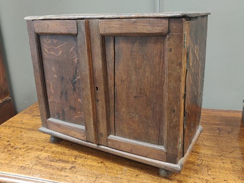 Lot 389 - An 18th century and later oak two door spice...