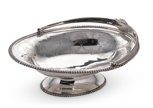 Lot 602 - A Victorian silver swing handled sweetmeat dish