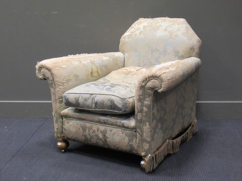 Lot 471 - A wide armchair with gilt bun feet and brass...