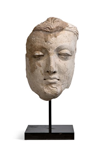 Lot 51 - A Gandharan stucco fragmentary face of Buddha, North West India, 3rd/4th century