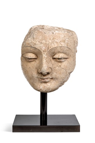 Lot 40 - A Gandharan stucco fragmentary face of Buddha, North West India, 3rd-5th century