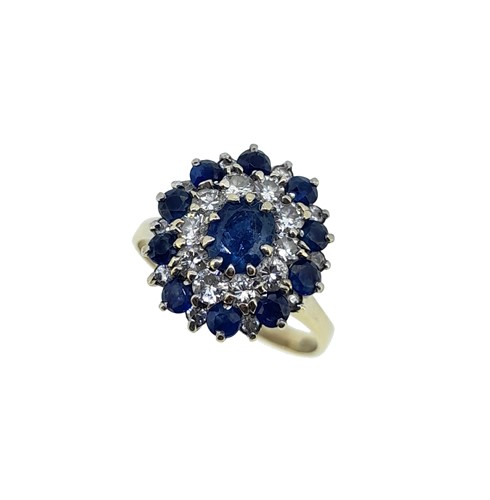 Lot 39 - A late 20th century sapphire and diamond cluster ring
