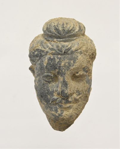 Lot 61 - A Gandharan small grey schist head of Buddha, North India/Pakistan, 3rd/4th century