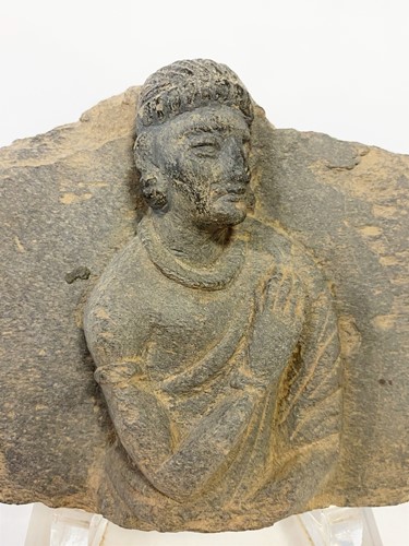 Lot 70 - A Gandharan grey schist panel with a Buddhist devotee, 2nd/3rd century