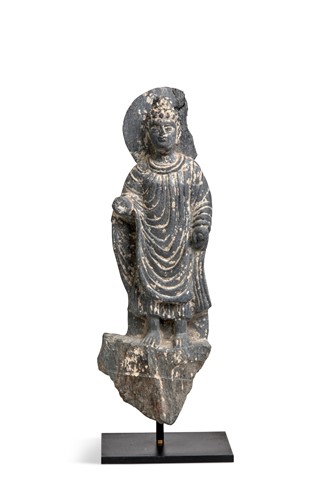 Lot 39 - A Gandharan grey schist figure of a standing Buddha, 2nd/3rd century