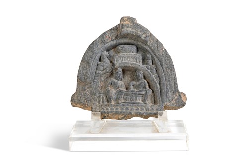 Lot 49 - A Gandharan grey schist arched panel of Buddhist devotees, 3rd/4th century
