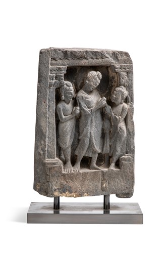 Lot 48 - A Gandharan grey schist Buddha and two disciples temple panel, 2nd/3rd century