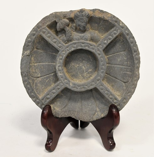 Lot 43 - A Gandharan grey schist temple boss, 2nd-4th century