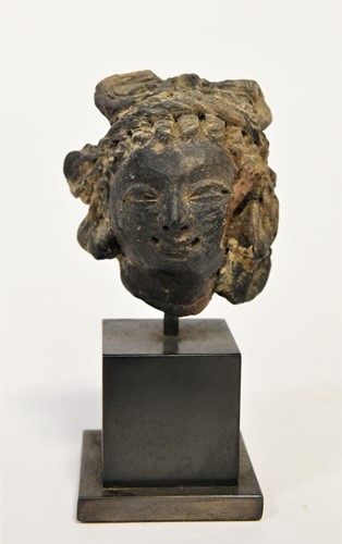 Lot 54 - A Greco-Gandharan small black painted terracotta head of a Maiden, 3rd-5th century