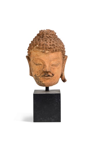 Lot 75 - A Thai small stucco head of Buddha, perhaps Sukothai, 13th century