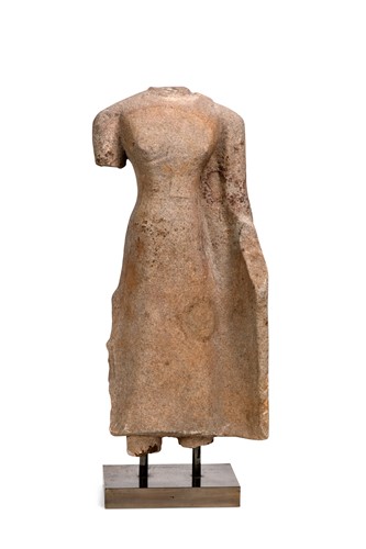 Lot 67 - A Khmer sandstone standing female torso, perhaps 11th/12th century