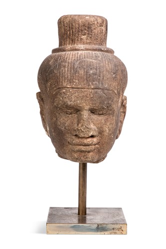 Lot 69 - A Khmer red sandstone head of Shiva, Baphuon style, perhaps 11th century