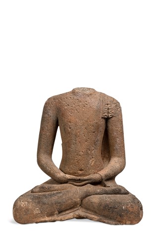 Lot 137 - A South East Asian, volcanic tufa stone torso of a monk, Candi Plaosan area, Indonesia, 9th century