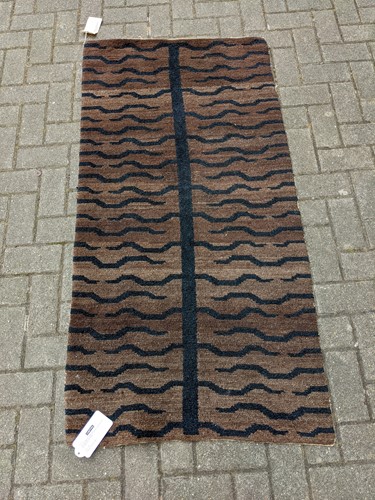 Lot 132 - A fine Tibet tiger skin Khaden rug