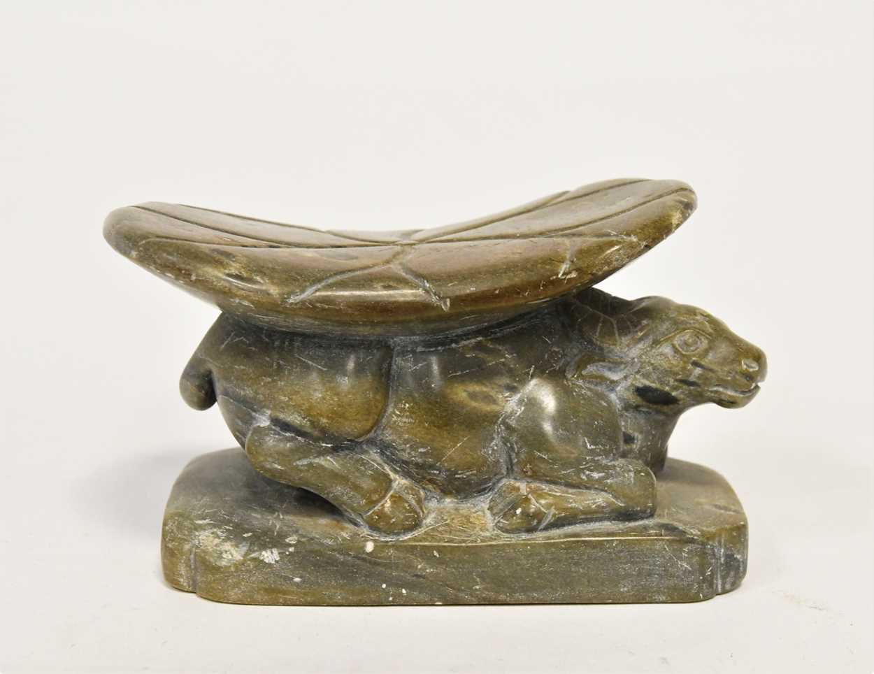 Lot 98 - A Chinese green stone buffalo headrest/pillow, Song Style