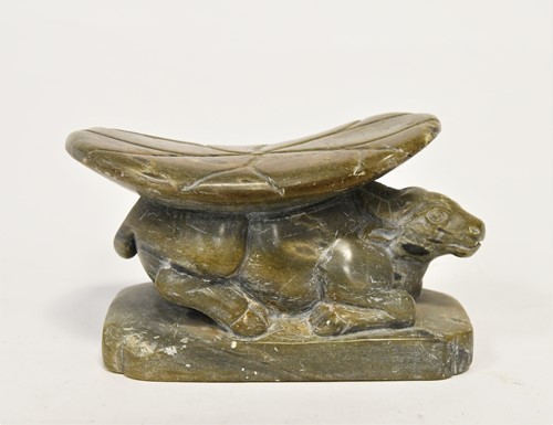 Lot 98 - A Chinese green stone buffalo headrest/pillow, Song Style