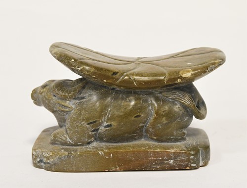 Lot 98 - A Chinese green stone buffalo headrest/pillow, Song Style