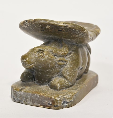 Lot 98 - A Chinese green stone buffalo headrest/pillow, Song Style