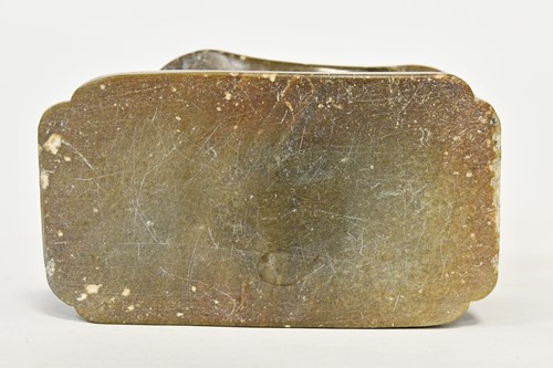 Lot 98 - A Chinese green stone buffalo headrest/pillow, Song Style