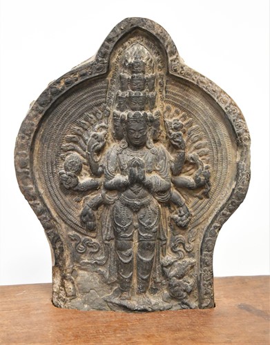 Lot 141 - A Nepalese pottery tile of the multi armed and headed Avalokitesvara, 18th/19th century