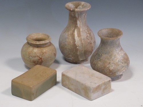 Lot 114 - Three Chinese stone "pale" vases, 15cm high...