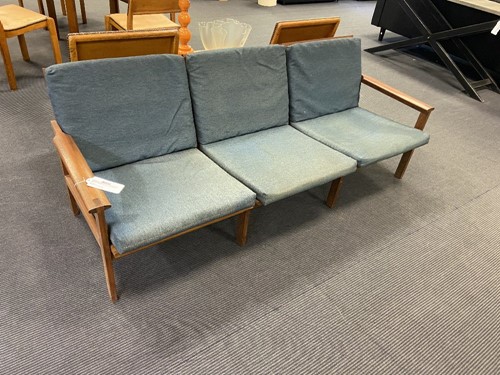 Lot 217 - Illum Wikkelso for Niels Eilersen, a Danish teak Capella sofa and matching armchair, 1960s