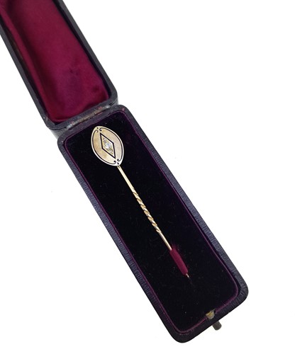 Lot 66 - A diamond and enamel stick pin