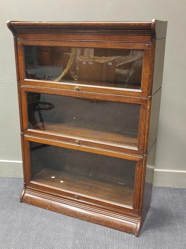 Lot 599 - An oak three section Globe Wernike type...