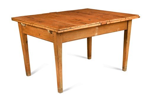 Lot 181 - A pine kitchen table with extending yew wood top, late 19th century
