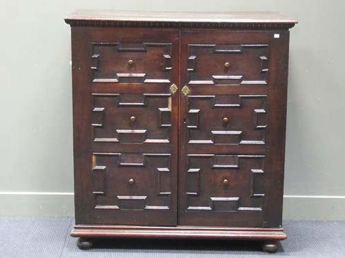 Lot 603 - A 17th century style oak panelled housekeepers...