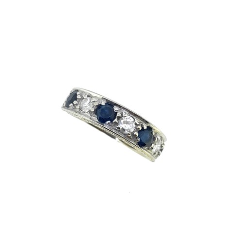 Lot 41 - A late 20th century 18ct gold sapphire and diamond half hoop ring