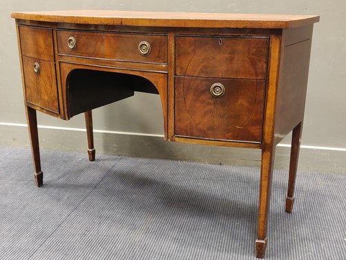 Lot 526 - A Regency style mahogany bowfront sideboard...