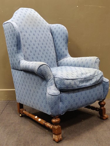 Lot 580 - A Wiliam and Mary style walnut wingback...
