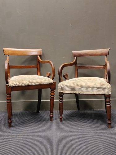 Lot 551 - A near pair of Regency mahogany dining elbow...