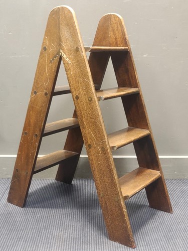 Lot 607 - A set of hinged mahogany library steps 100cm