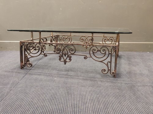 Lot 636 - A wrought iron coffee table with square...