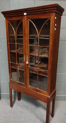 Lot 651 - An Edwardian mahogany and oak glazed bookcase...